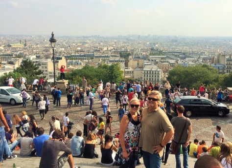 See? Still smiling! (Note our favorite street performer warming up in the background.)