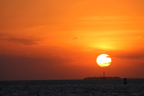 Sunset from Sunset Pier -- a couple of drinks to justify taking the table